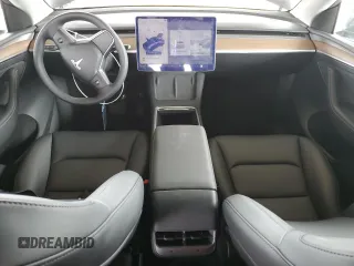 2025 Tesla Model Y Long Range with VIN 7SAYGDED2SF234388, listed as a Copart auction lot 47250965 with 3,702 mi miles and Salvage Title. Bid and sale history available at DreamBid. Image 8.