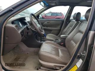 1999 Toyota Camry LE z VIN JT2BF28K6X0215555, wystawiony jako Copart lot #52587985 z przebiegiem 201 225 mil mil oraz Szkoda całkowita • Salvage title. Historia ofert i sprzedaży dostępna na DreamBid. Obrazek 7.