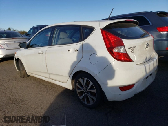 2015 Hyundai Accent Sport with VIN KMHCU5AE2FU217782, listed as a Copart auction lot 41446935 with 99,764 mi miles and Clean Title. Bid and sale history available at carsss.com. Image 2.