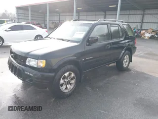 2000 Isuzu Rodeo S with VIN 4S2CK58W0Y4342408, listed as a IAAI auction lot 41659468 with 173,096 mi miles. Bid and sale history available at carsss.com. Image 2.