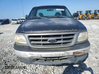 2000 Ford F-150 XL with VIN 1FTRF18W9YNB95521, listed as a Copart auction lot 57720434 with 203,143 mi miles and Clean title. Bid and sale history available at DreamBid. Image 5.