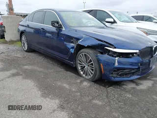 2019 BMW 5 Series 530e iPerformance with VIN WBAJA9C59KB389898, listed as a IAAI auction lot 41479595 with 90,965 mi miles. Bid and sale history available at carsss.com. Image 1.