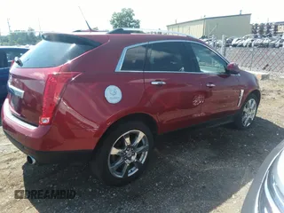 2011 Cadillac SRX Premium Collection with VIN 3GYFNCEY0BS609817, listed as a IAAI auction lot 39865672 with 114,665 mi miles. Bid and sale history available at carsss.com. Image 4.