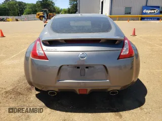2014 Nissan 370Z Nismo with VIN JN1AZ4EH7EM633324, listed as a Copart auction lot 53812335 with 57,856 mi miles and Salvage Title. Bid and sale history available at DreamBid. Image 6.