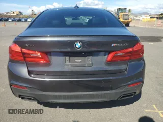 2019 BMW 5 Series M550i xDrive with VIN WBAJB9C57KB289036, listed as a Copart auction lot 86292134 with 28,103 mi miles and Salvage title. Bid and sale history available at DreamBid. Image 6.