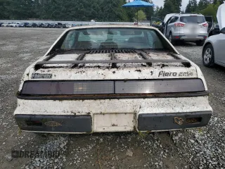 1984 Pontiac Fiero z VIN 1G2AF37R6EP320306, wystawiony jako Copart lot #68255394 z przebiegiem 49 284 mil mil oraz Tytuł czysty. Historia ofert i sprzedaży dostępna na DreamBid. Obrazek 6.