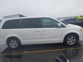 2012 Dodge Grand Caravan SXT with VIN 2C4RDGCG4CR304472, listed as a IAAI auction lot 41396437 with 180,309 mi miles and . Bid and sale history available at DreamBid. Image 13.