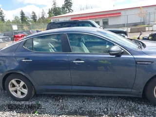 2015 Kia Optima LX z VIN KNAGM4A74F5590332, wystawiony jako IAAI lot #42304364 z przebiegiem 131 720 mil mil oraz . Historia ofert i sprzedaży dostępna na DreamBid. Obrazek 13.
