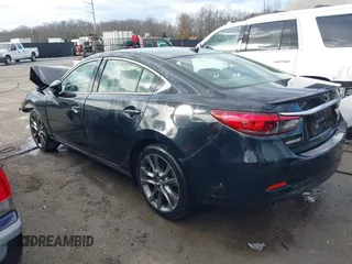 2016 Mazda 6 i Grand Touring with VIN JM1GJ1W54G1454115, listed as a IAAI auction lot 41203298 with 104,632 mi miles and . Bid and sale history available at DreamBid. Image 3.