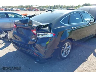 2015 Ford Fusion Titanium Hybrid with VIN 3FA6P0RUXFR119698, listed as a IAAI auction lot 41791411 with 140,646 mi miles. Bid and sale history available at carsss.com. Image 18.