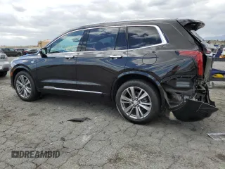 2023 Cadillac XT6 FWD Premium Luxury with VIN 1GYKPCRS5PZ220616, listed as a Copart auction lot 56913725 with 25,860 mi miles and Salvage title. Bid and sale history available at DreamBid. Image 2.