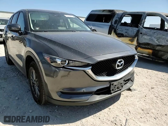 2017 Mazda CX-5 Touring with VIN JM3KFACL1H0100436, listed as a Copart auction lot 53058875 with 77,205 mi miles and Salvage Title. Bid and sale history available at DreamBid. Image 12.