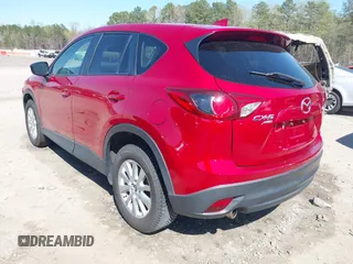 2016 Mazda CX-5 Touring with VIN JM3KE4CY0G0890309, listed as a IAAI auction lot 41890840 with 89,023 mi miles and . Bid and sale history available at carsss.com. Image 3.