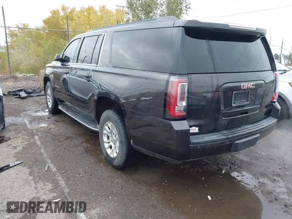 2015 GMC Yukon XL SLT with VIN 1GKS1HKC8FR219289, listed as a IAAI auction lot 40772496 with 163,477 mi miles. Bid and sale history available at carsss.com. Image 3.