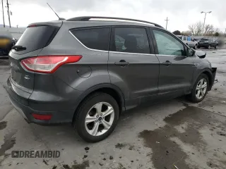 2016 Ford Escape SE with VIN 1FMCU9G97GUA48555, listed as a Copart auction lot 49285395 with 106,941 mi miles and Salvage Title. Bid and sale history available at DreamBid. Image 3.