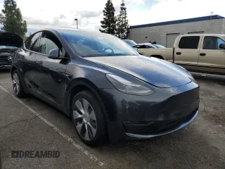2024 Tesla Model Y with VIN 7SAYGDED1RF052031, listed as a Copart auction lot 48507865 with 5,365 mi miles and Salvage title. Bid and sale history available at DreamBid. Image 4.