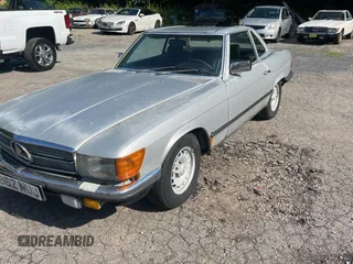 1984 Mercedes-Benz SL with VIN WDB1070421A009542, listed as a Copart auction lot 65327125 with 142,656 mi miles and Clean title. Bid and sale history available at DreamBid. Image 2.