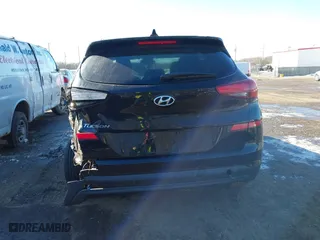 2019 Hyundai Tucson Value with VIN KM8J33A4XKU979791, listed as a IAAI auction lot 41255630 with 90,807 mi miles. Bid and sale history available at carsss.com. Image 16.