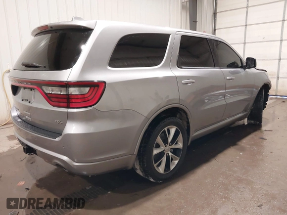 2014 Dodge Durango R/T with VIN 1C4SDJCTXEC558937, listed as a IAAI auction lot 41570244 with 174,724 mi miles and . Bid and sale history available at DreamBid. Image 4.