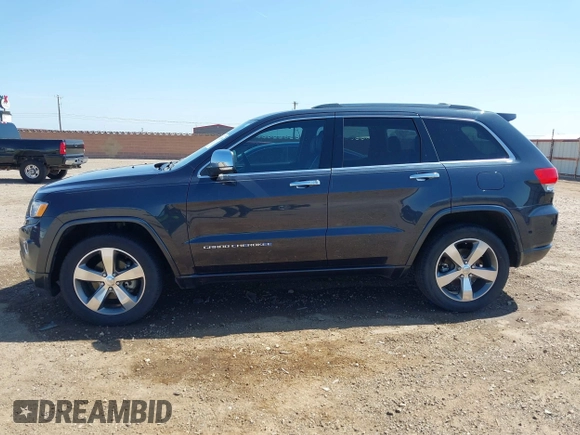 2015 Jeep Grand Cherokee Overland with VIN 1C4RJECG3FC635327, listed as a IAAI auction lot 41910559 with 118,519 mi miles and . Bid and sale history available at DreamBid. Image 14.