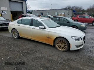2014 BMW 7 Series ALPINA B7 xDrive with VIN WBAYF8C5XED142604, listed as a Copart auction lot 52551345 with 124,474 mi miles and Clean Title. Bid and sale history available at DreamBid. Image 4.