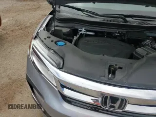 2022 Honda Pilot Elite z VIN 5FNYF6H03NB024309, wystawiony jako Copart lot #70763005 z przebiegiem 25 703 mil mil oraz Szkoda całkowita • Salvage title. Historia ofert i sprzedaży dostępna na DreamBid. Obrazek 13.