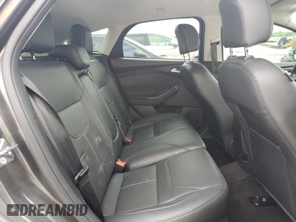 2017 Ford Focus Titanium z VIN 1FADP3N22HL307260, wystawiony jako Copart lot #61399785 z przebiegiem 103 293 mil mil oraz Szkoda całkowita • Salvage title. Historia ofert i sprzedaży dostępna na DreamBid. Obrazek 10.