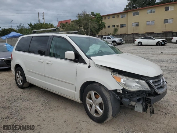 2011 Volkswagen Routan SE with VIN 2V4RW3DG5BR766741, listed as a Copart auction lot 80923713 with 169,703 mi miles and Salvage Title. Bid and sale history available at carsss.com. Image 4.