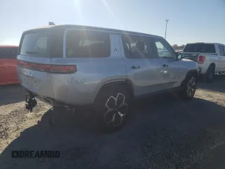 2024 Rivian R1S Adventure z VIN 7PDSGBBA5RN044560, wystawiony jako Copart lot #70594924 z przebiegiem 2449 mil mil oraz Szkody całkowita. Historia ofert i sprzedaży dostępna na DreamBid. Obrazek 3.