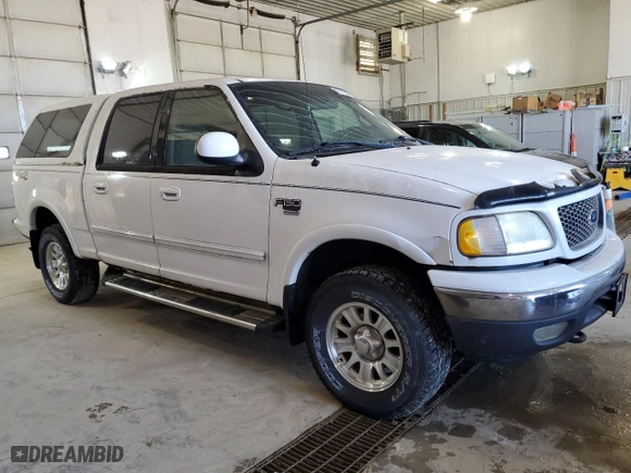2001 Ford F-150 SuperCrew XLT with VIN 1FTRW08L21KE03150, listed as a Copart auction lot 67372004 with 184,124 mi miles and Salvage Title. Bid and sale history available at carsss.com. Image 4.