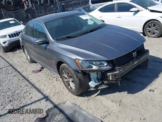 2017 Volkswagen Passat S z VIN 1VWAT7A35HC060649, wystawiony jako IAAI lot #42183544 z przebiegiem 89 000 mil mil oraz . Historia ofert i sprzedaży dostępna na DreamBid. Obrazek 1.
