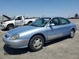 1998 Ford Taurus with VIN 1FAFP52S9WG185785, listed as a Copart auction lot 61690895 with 126,574 mi miles and Salvage title. Bid and sale history available at DreamBid. Image 1.