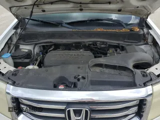 2015 Honda Pilot EX-L z VIN 5FNYF3H77FB007042, wystawiony jako Copart lot #60122705 z przebiegiem 183 727 mil mil oraz Szkoda całkowita • Salvage title. Historia ofert i sprzedaży dostępna na DreamBid. Obrazek 12.