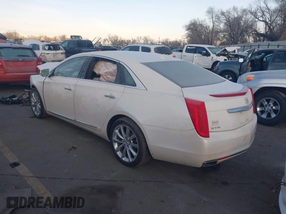 2014 Cadillac XTS Premium with VIN 2G61P5S30E9123057, listed as a IAAI auction lot 41301457 with 123,042 mi miles and . Bid and sale history available at DreamBid. Image 3.