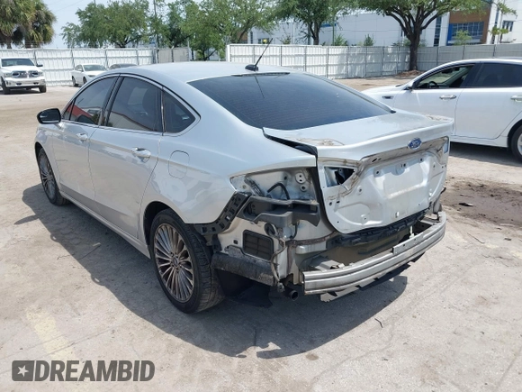 2014 Ford Fusion Titanium with VIN 3FA6P0K99ER358244, listed as a IAAI auction lot 42085703 with 194,626 mi miles. Bid and sale history available at carsss.com. Image 3.