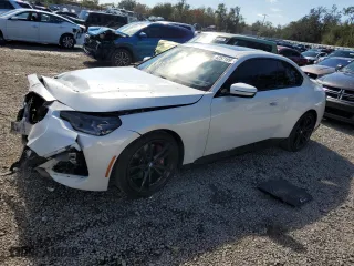 2024 BMW 2 Series 230i with VIN 3MW23CM04R8E87179, listed as a Copart auction lot 42571995 with 6,617 mi miles and Salvage Title. Bid and sale history available at carsss.com. Image 1.