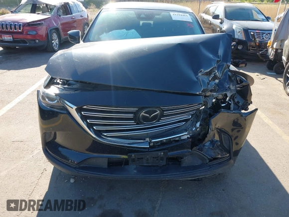 2018 Mazda CX-9 Sport with VIN JM3TCBBY6J0222750, listed as a IAAI auction lot 42294464 with 63,927 mi miles and . Bid and sale history available at DreamBid. Image 12.
