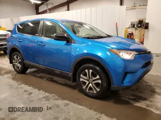 2018 Toyota RAV4 LE with VIN JTMBFREV9JJ197097, listed as a Copart auction lot 50042325 with 167,978 mi miles and Salvage Title. Bid and sale history available at DreamBid. Image 4.