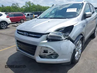 2014 Ford Escape Titanium with VIN 1FMCU0JX7EUA28824, listed as a IAAI auction lot 42065325 with 107,761 mi miles. Bid and sale history available at carsss.com. Image 6.
