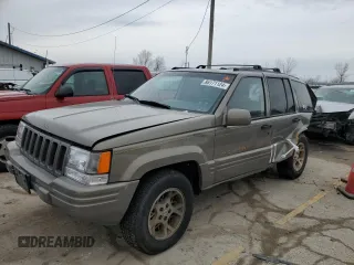 1997 Jeep Grand Cherokee Limited with VIN 1J4GZ78Y3VC568413, listed as a Copart auction lot 86171124 with 104,558 mi miles and Salvage Title. Bid and sale history available at carsss.com. Image 1.
