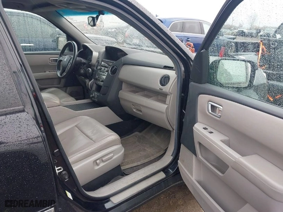 2012 Honda Pilot Touring with VIN 5FNYF4H94CB011228, listed as a IAAI auction lot 41808492 with 231,047 mi miles. Bid and sale history available at carsss.com. Image 5.