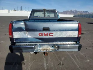 1990 GMC Sierra 1500 with VIN 1GTFC24K2LE554012, listed as a Copart auction lot 86004084 with 174,771 mi miles and Clean Title. Bid and sale history available at DreamBid. Image 6.
