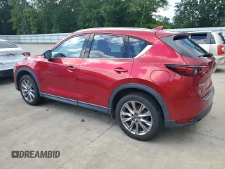 2019 Mazda CX-5 Grand Touring with VIN JM3KFADM2K1657915, listed as a Copart auction lot 56647145 with 85,095 mi miles and Salvage title. Bid and sale history available at DreamBid. Image 2.