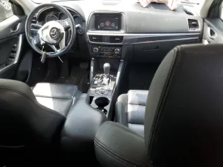 2016 Mazda CX-5 Grand Touring with VIN JM3KE2DY0G0804354, listed as a Copart auction lot 50311185 with 105,588 mi miles and Salvage Title. Bid and sale history available at carsss.com. Image 8.
