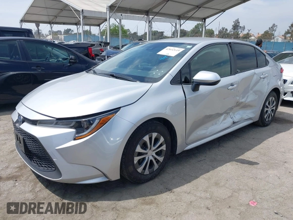 2022 Toyota Corolla Hybrid LE with VIN JTDEAMDE6NJ056705, listed as a IAAI auction lot 42032119 with 197,030 mi miles. Bid and sale history available at carsss.com. Image 2.