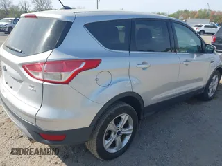 2015 Ford Escape SE with VIN 1FMCU9GX9FUC19545, listed as a IAAI auction lot 42128800 with 157,506 mi miles. Bid and sale history available at carsss.com. Image 4.