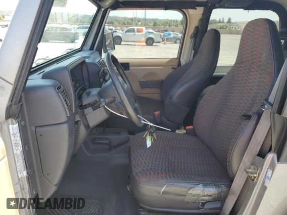 2000 Jeep Wrangler SE with VIN 1J4FA29P7YP737289, listed as a Copart auction lot 61869865 with 91,097 mi miles and Salvage title. Bid and sale history available at DreamBid. Image 7.