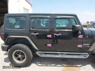 2013 Jeep Wrangler Unlimited Sport with VIN 1C4BJWDG9DL569109, listed as a IAAI auction lot 42115703 with 120,803 mi miles. Bid and sale history available at carsss.com. Image 13.