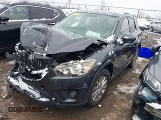 2014 Mazda CX-5 Touring with VIN JM3KE2CY2E0407453, listed as a IAAI auction lot 41564916 with 104,852 mi miles. Bid and sale history available at carsss.com. Image 2.