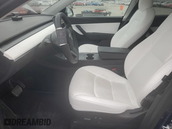 2022 Tesla Model Y Long Range z VIN 7SAYGDEE6NF429651, wystawiony jako Copart lot #57172355 z przebiegiem 19 499 mil mil oraz Szkoda całkowita • Salvage title. Historia ofert i sprzedaży dostępna na DreamBid. Obrazek 7.